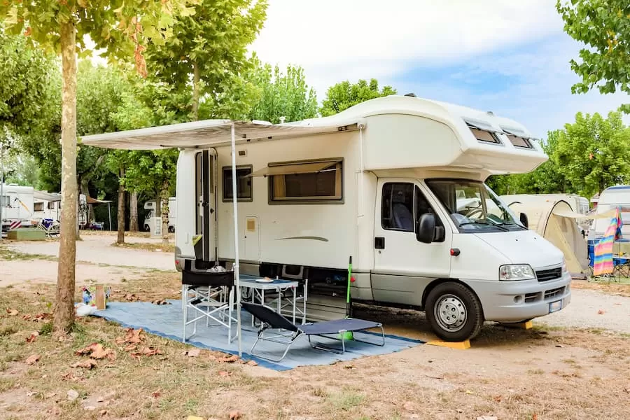 A camper set up on a campground.